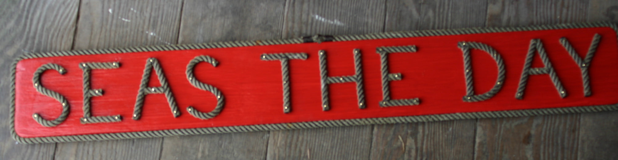SEAS THE DAY sign - Alaska Rug Company