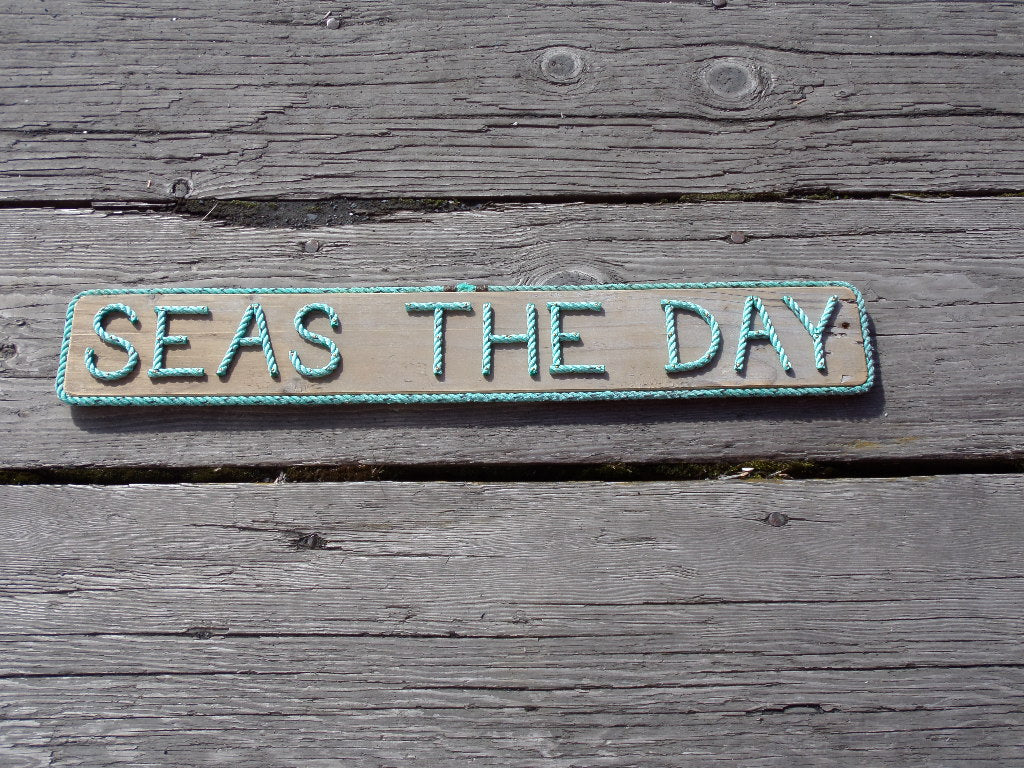 SEAS THE DAY sign - Alaska Rug Company
