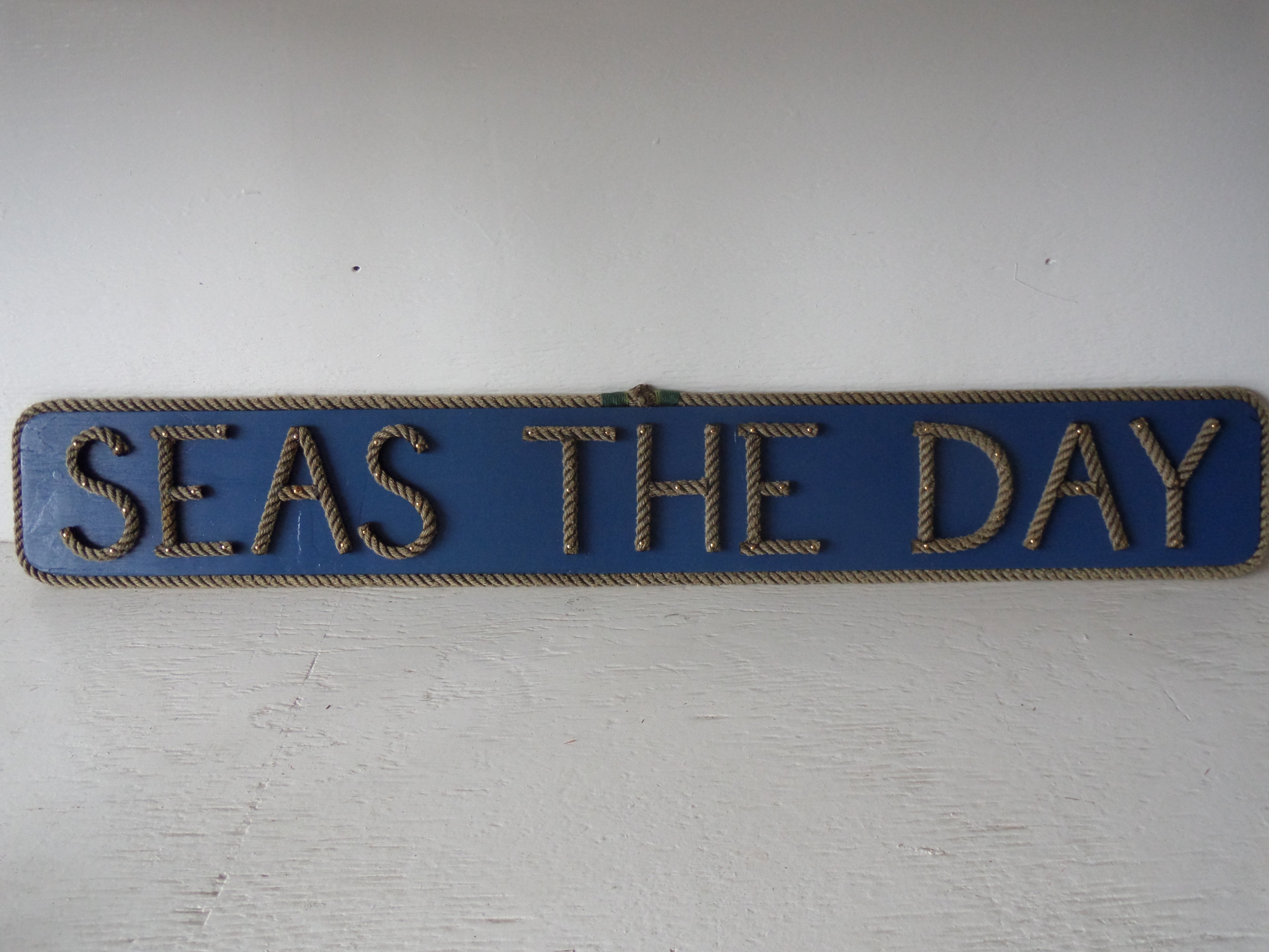 SEAS THE DAY sign - Alaska Rug Company