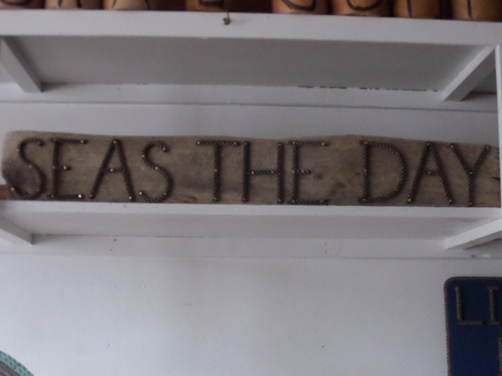 SEAS THE DAY sign - Alaska Rug Company