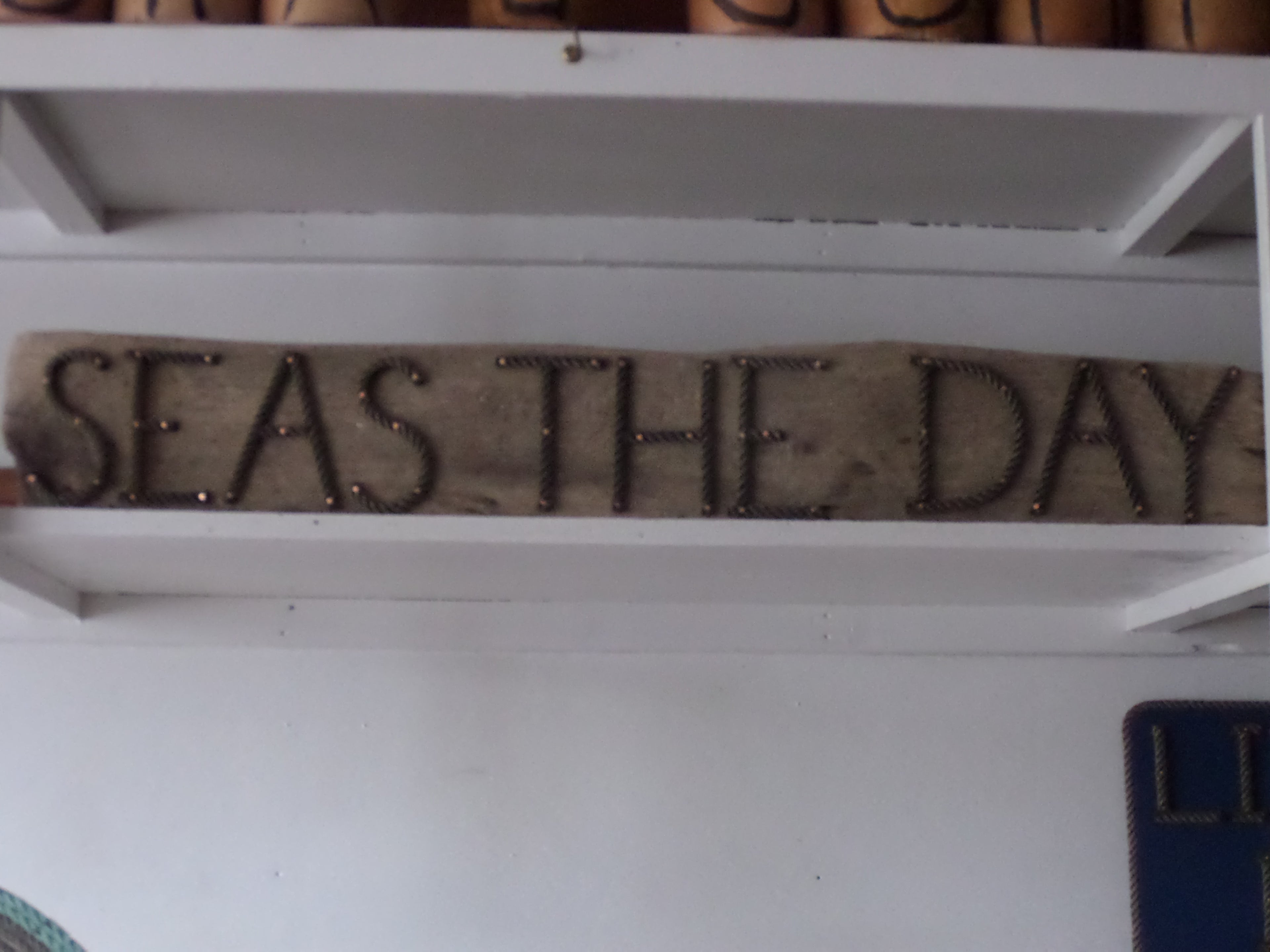 SEAS THE DAY sign - Alaska Rug Company