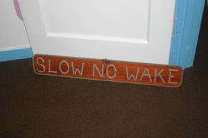 SLOW NO WAKE sign - Alaska Rug Company