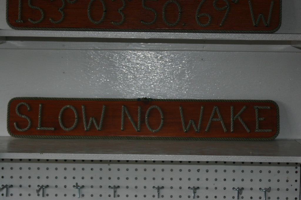 SLOW NO WAKE sign - Alaska Rug Company