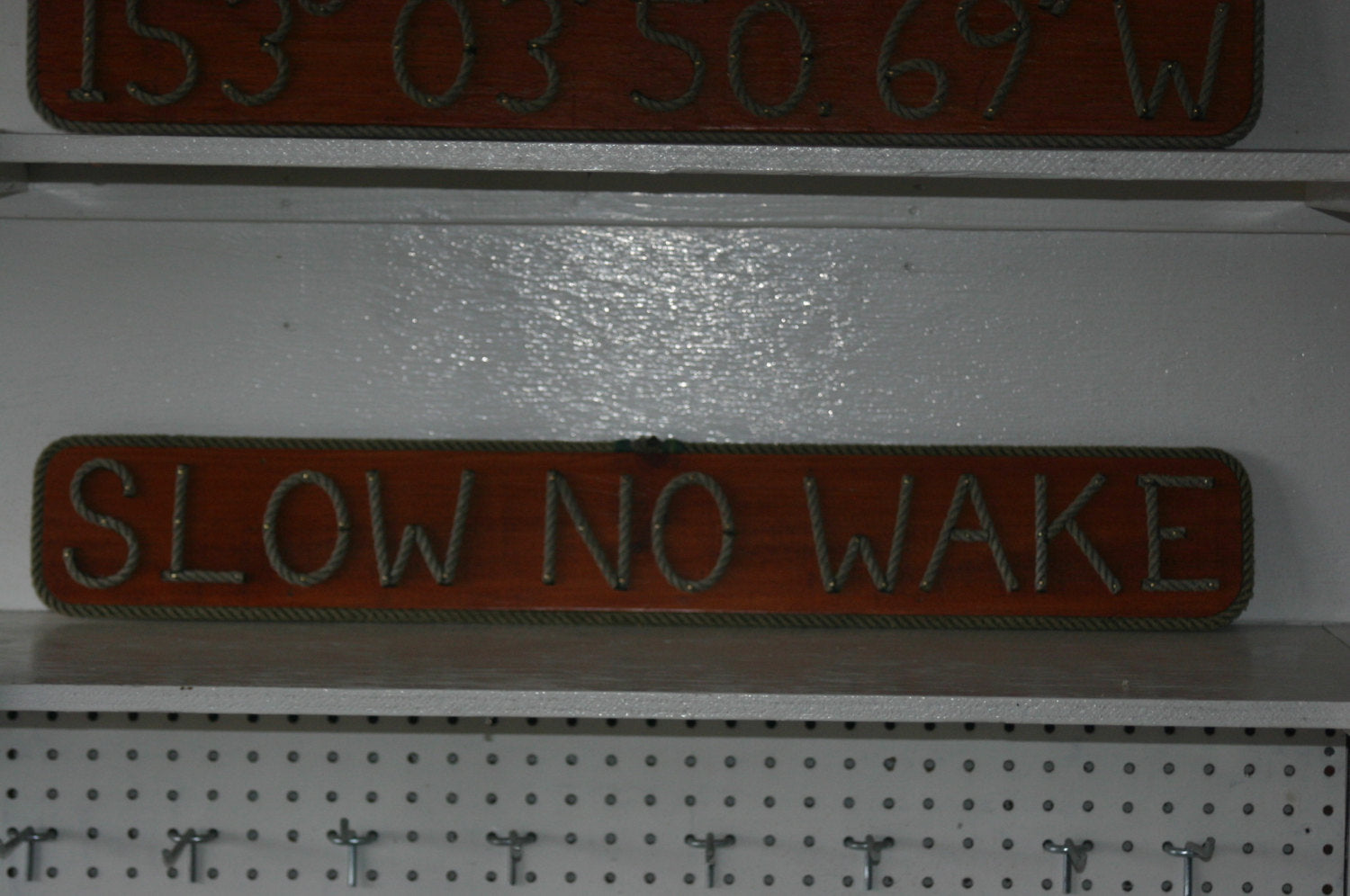SLOW NO WAKE sign - Alaska Rug Company