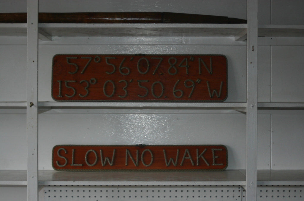 SLOW NO WAKE sign - Alaska Rug Company