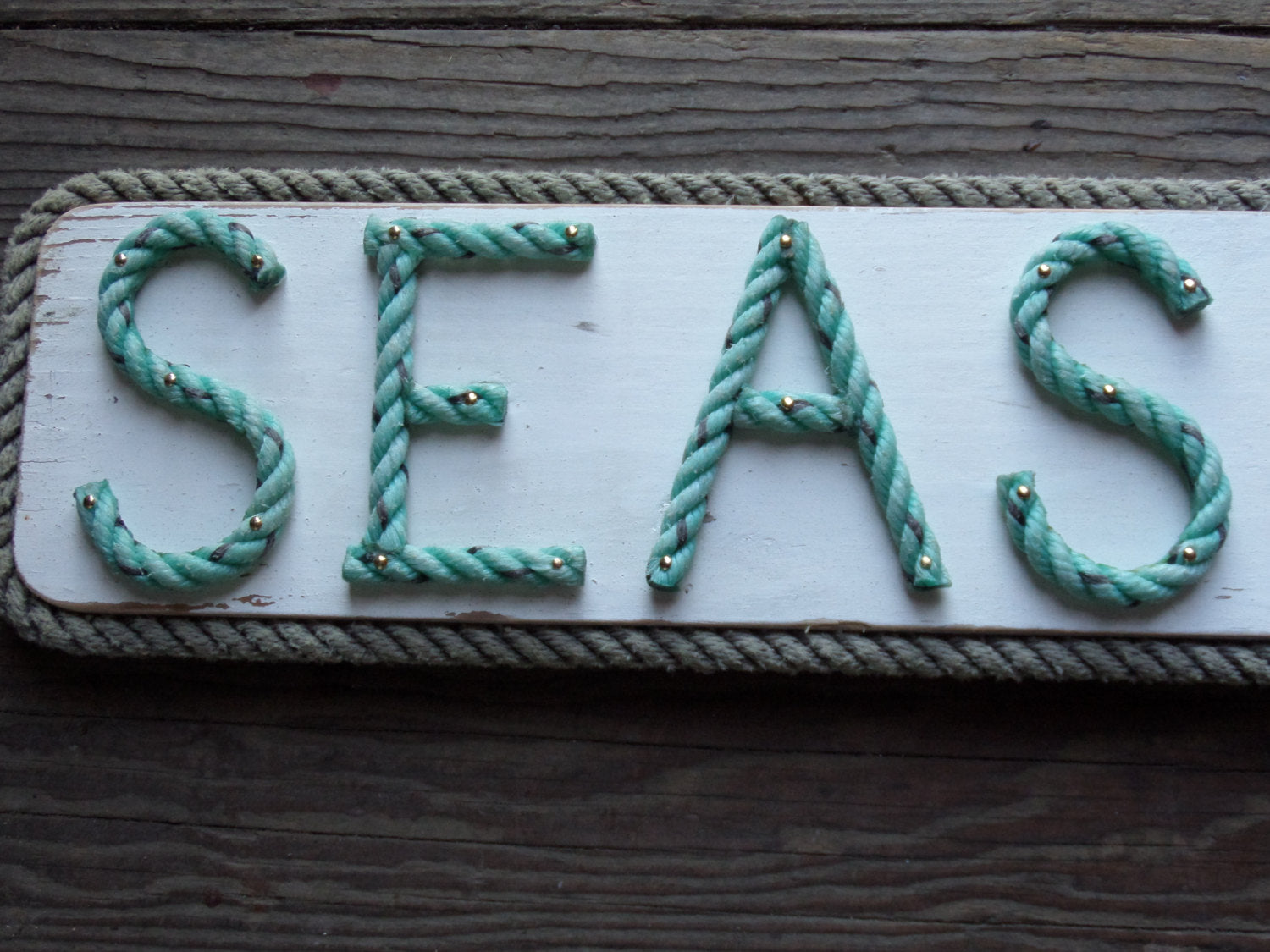 SEAS THE DAY sign - Alaska Rug Company