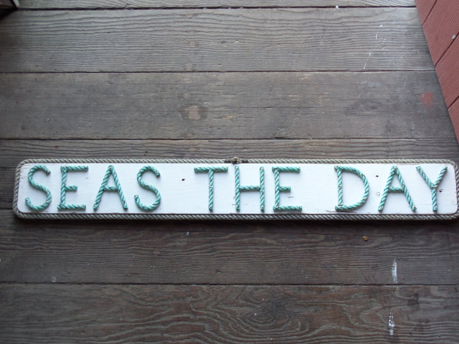 SEAS THE DAY sign - Alaska Rug Company